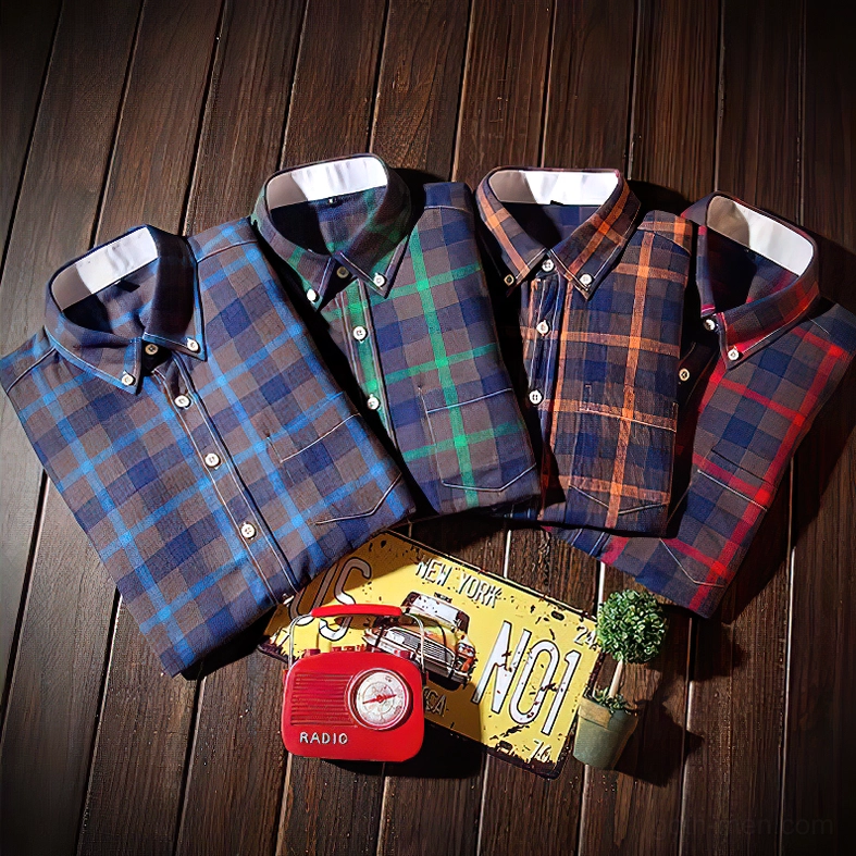 Four gothic tartan plaid shirts in multiple colors displayed together overhead view
