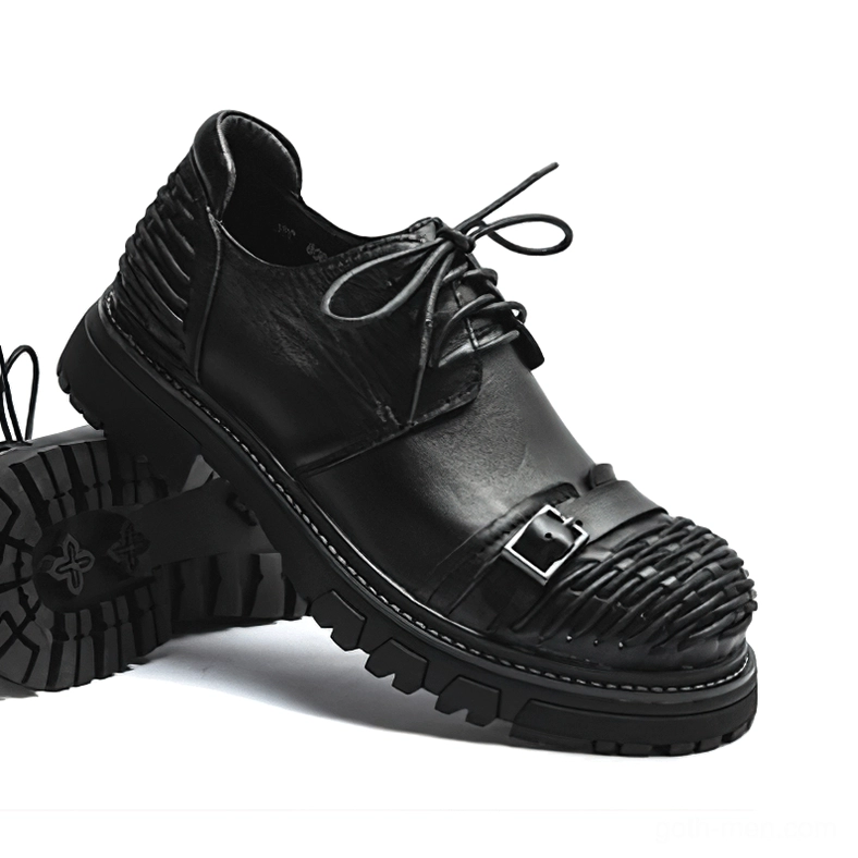 Black leather gothic boots bottom angle showing cross-pattern sole and lace closure system