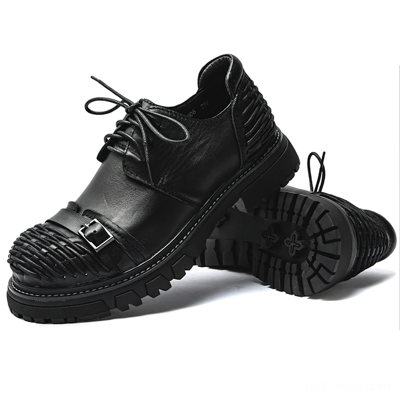 Black leather gothic boots with cross-pattern lug outsole bottom view showing durable rubber sole
