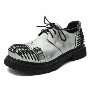 Gray distressed leather gothic work boots with industrial buckle and lace-up design three-quarter front angle