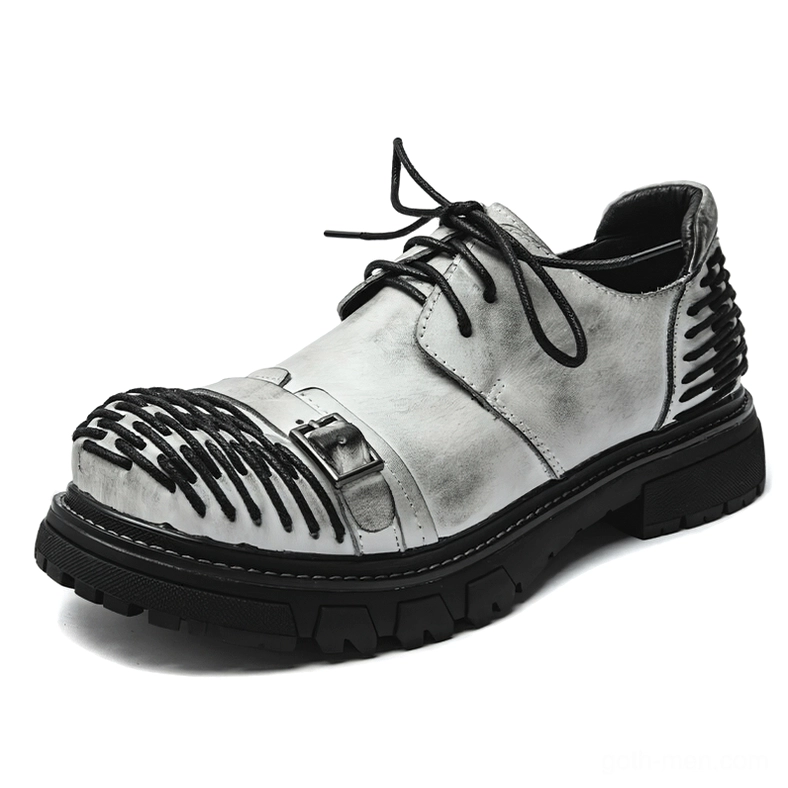 Gray distressed leather gothic work boots with industrial buckle and lace-up design three-quarter front angle