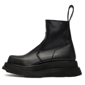 Black Chelsea boot with faux fur lining option, side profile highlighting squared toe and stacked heel