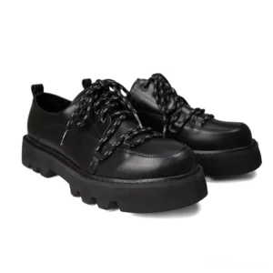 Black gothic platform derby shoes with reflective star laces and chunky lug sole - front three-quarter view pair