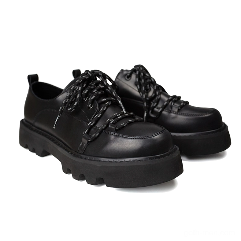 Black gothic platform derby shoes with reflective star laces and chunky lug sole - front three-quarter view pair
