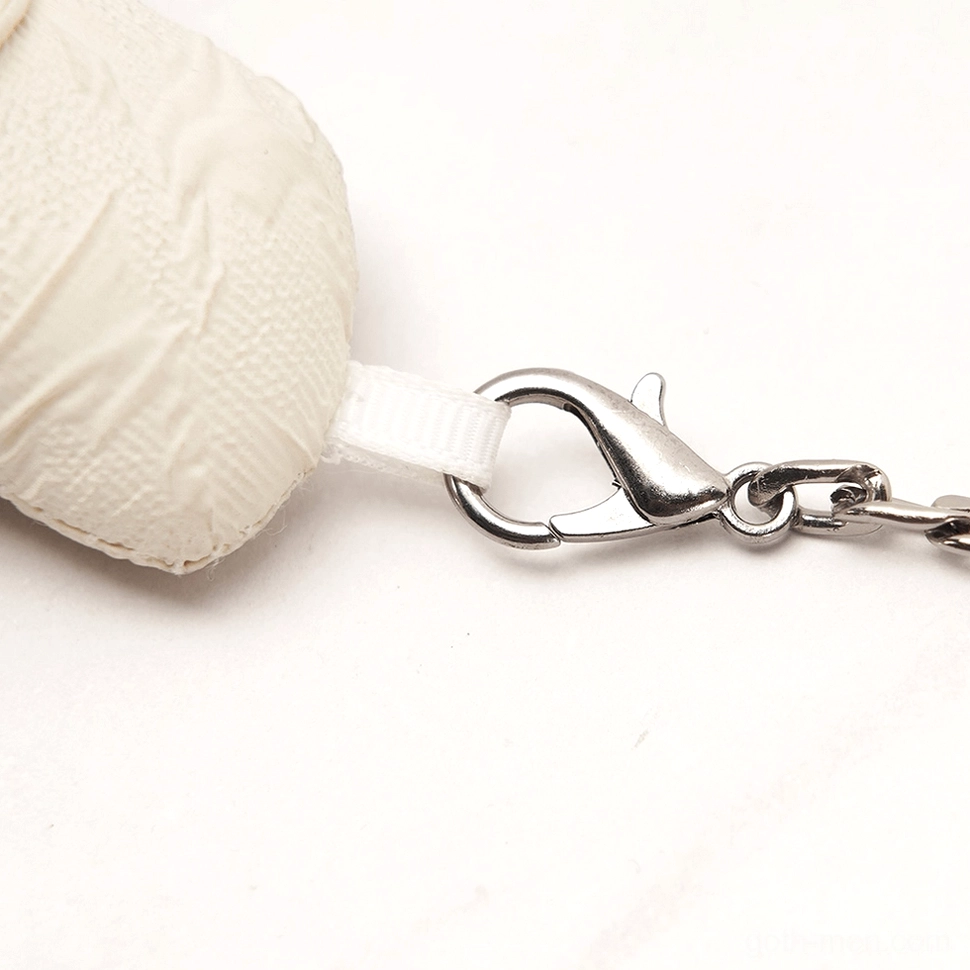Close-up of silver metal chain hardware and secure lobster clasp on gothic plush ornament
