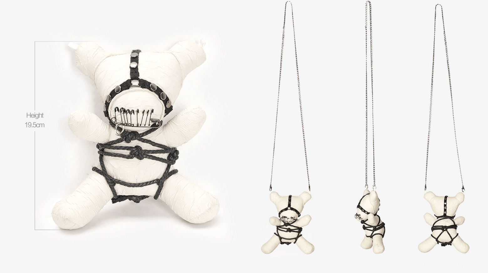 Wearable gothic talisman: plush ornament with black bondage-inspired harness and edgy aesthetic