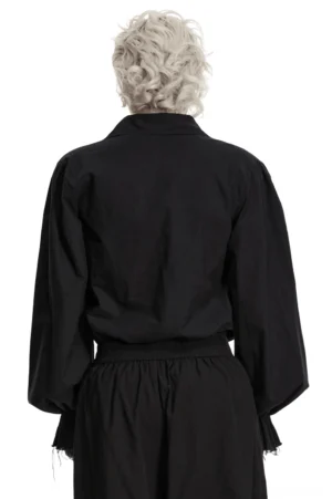 Black gothic poet shirt back view showing gathered bishop sleeves and raw frayed cuffs