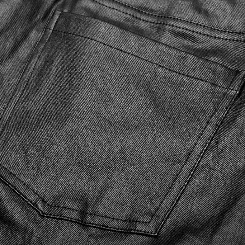 Close-up front view of black gothic leather pants stitched patch pocket and fabric detail
