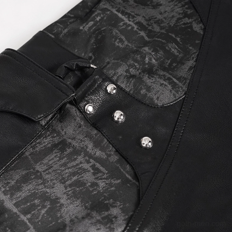 Gothic punk black trousers showing distressed fabric texture and pocket construction, flat lay detail