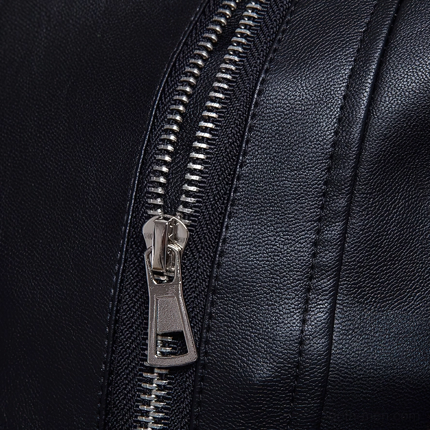 Cuff zipper detail showing silver metal hardware and professional stitching work