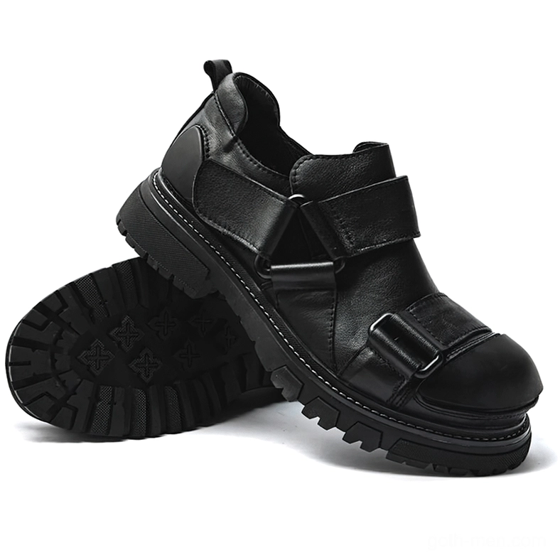Solid black full grain leather gothic punk loafers with velcro straps and chunky rubber sole, three-quarter view and front sole