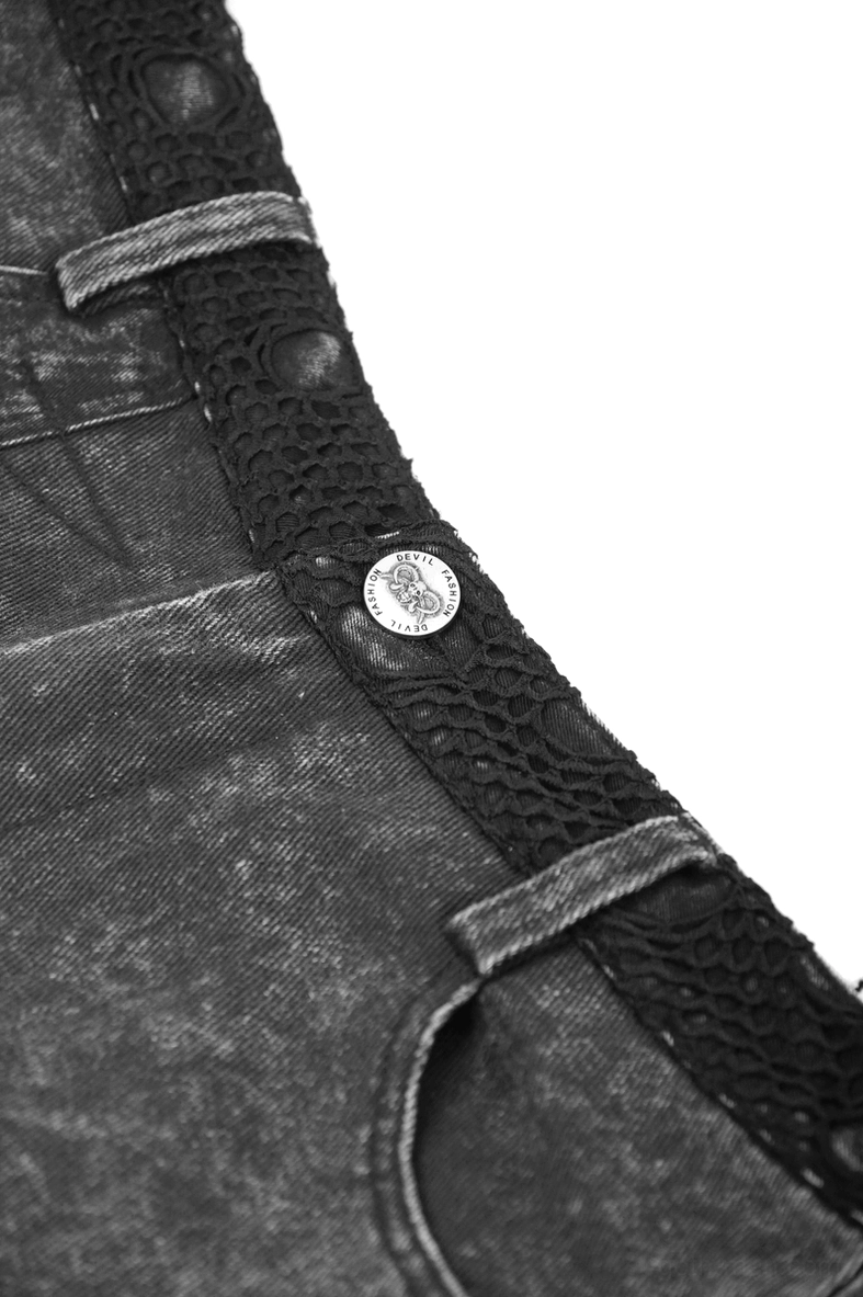 Close up detail shot of black denim shorts showing metal button eyelet snake texture waist strap and fabric texture