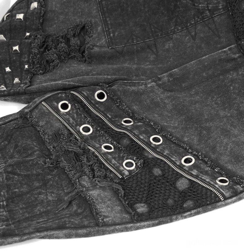Detailed view of gothic punk shorts distressed rips metal rivets and eyelet embellishments on black denim fabric