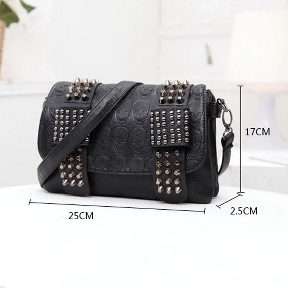 Black skull embossed studded messenger bag three-quarter view with size measurement 25x17x2.5cm metal rivet detailing and chain strap