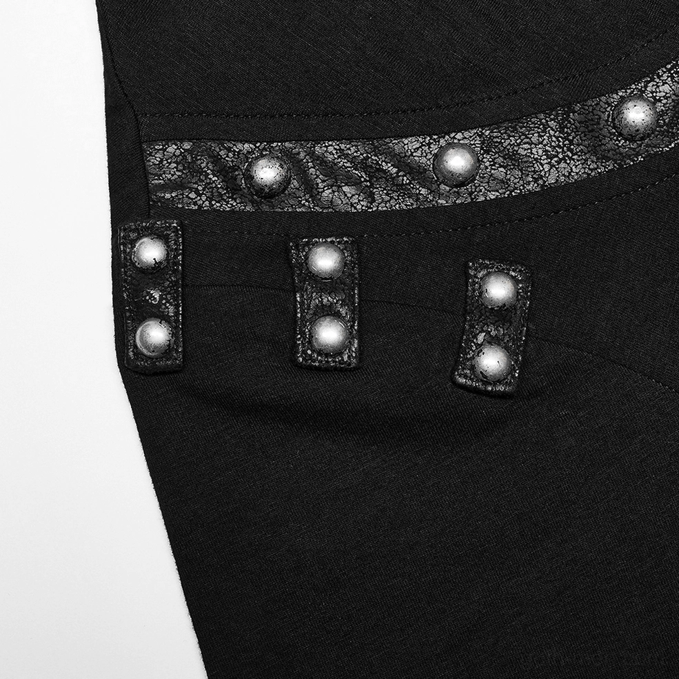 Macro detail of shoulder rivet embellishment on asymmetric gothic punk t-shirt leather patch