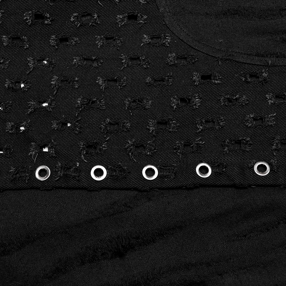 Macro close-up of black distressed knit fabric with metal eyelets and perforated hole pattern texture