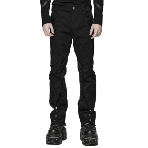 Male model wearing black spider mesh gothic punk pants with metal eyelets and ankle buttons, front view studio shot