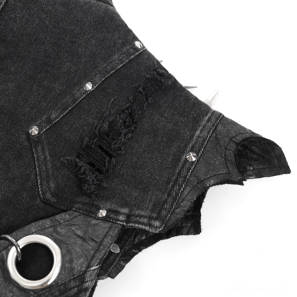 Gothic punk denim vest displaying multiple chain drapes and metal decorative elements on dark background