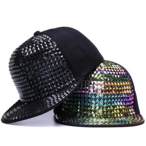 Black and iridescent rainbow pyramid studded snapback caps, front oblique view showing metallic spike contrast