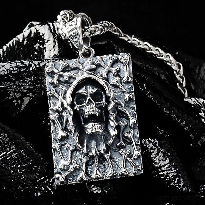 Close-up of hooded skull with intricate bone pattern relief frame, antique silver finish gothic pendant