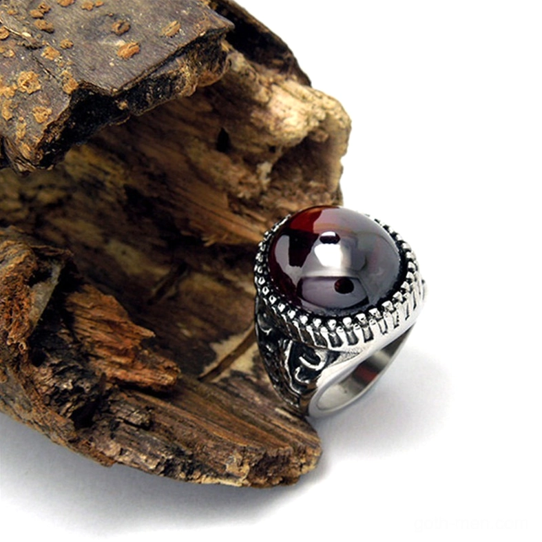Red gothic statement ring side profile, polished gemstone, intricate stainless steel band work