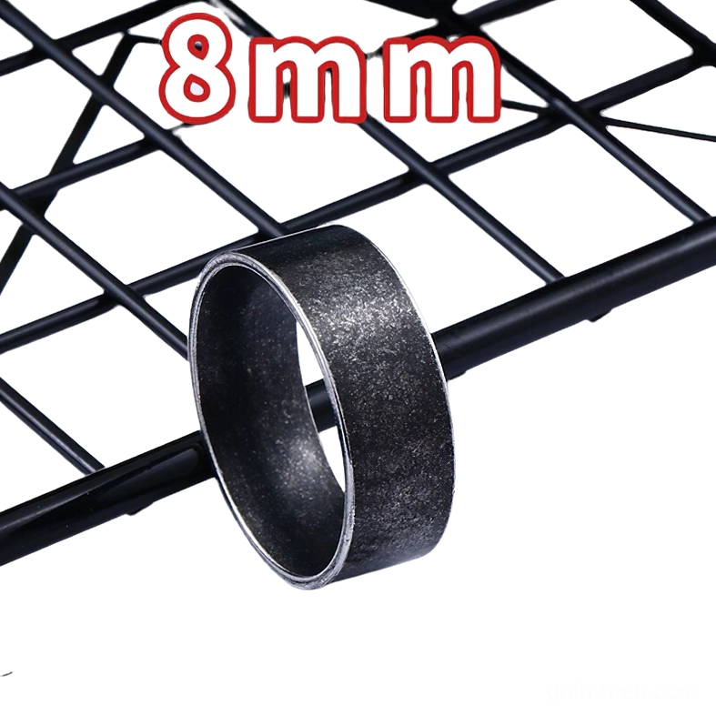 8mm width gothic stainless steel band ring on black grid shelf, three-quarter view showcasing wider band, matte black vintage texture, bold minimalist design for men and women