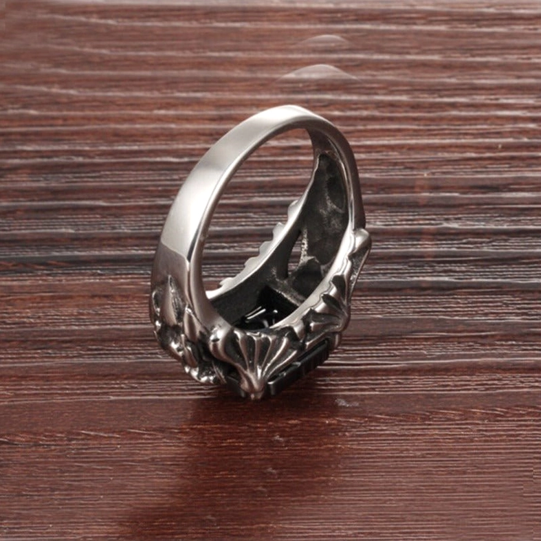 Bottom profile view of gothic ring showing aged silver finish and detailed carved patterns underneath base with hidden gem detail