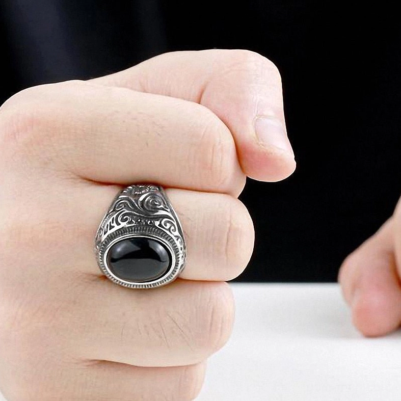 Gothic ring sizing guide, stainless steel band on hand, proper fit demonstration