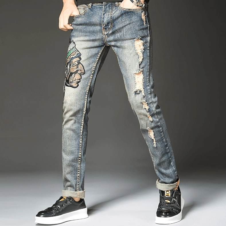 Front full-length view of men's gothic embroidered ripped denim with heavy distressing on thighs, slim fit cut, alternative fashion style