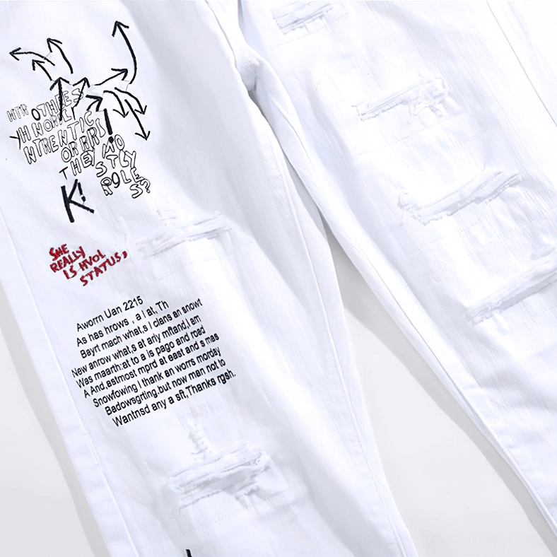 Gothic slim ripped jeans showing ankle and hem details with graffiti print design