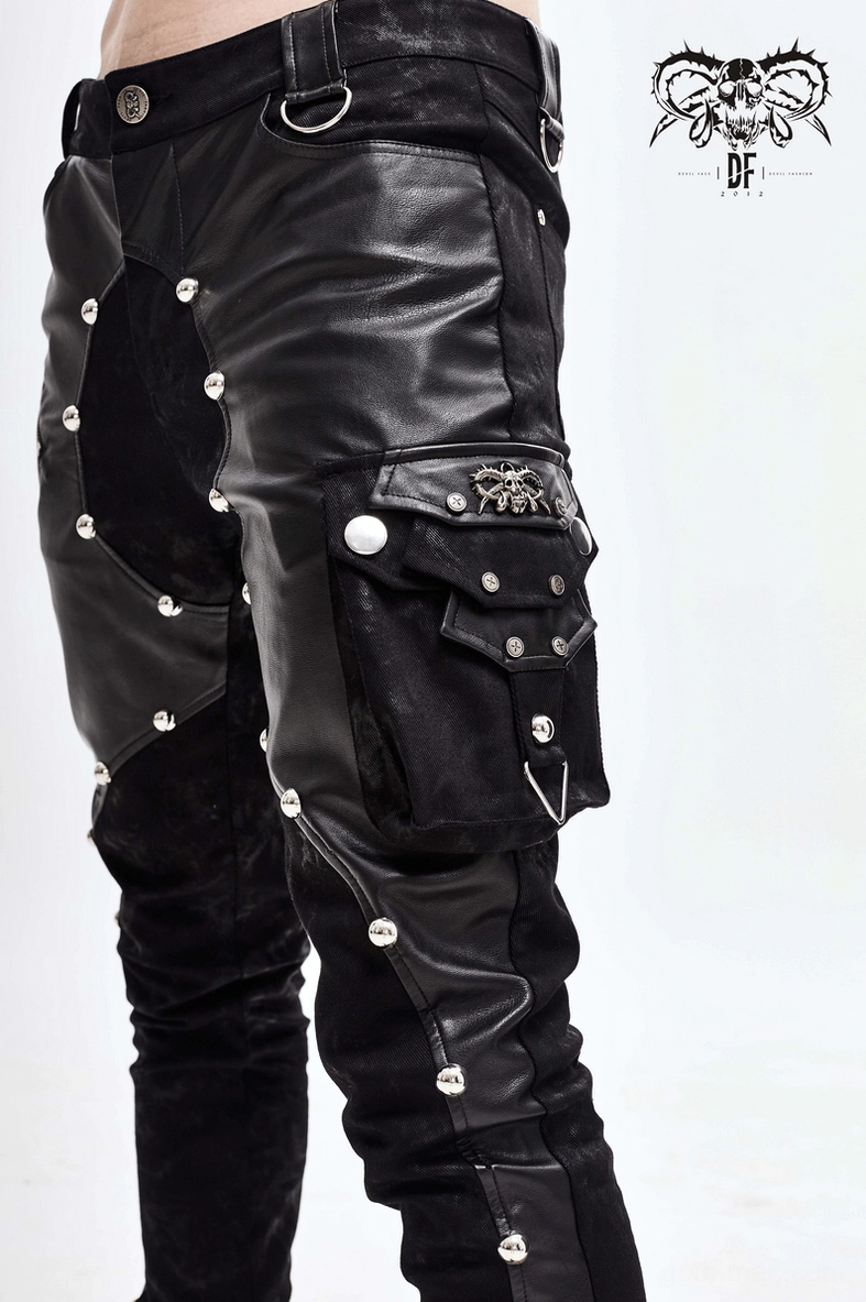 Gothic rivet trousers side view detail - asymmetric leather panel with metal rivet trim and leg opening