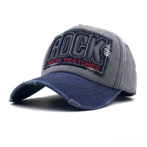 Gothic ROCK baseball cap with grey crown and navy blue distressed brim, front three-quarter view