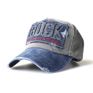 Grey body navy and red rock embroidery gothic baseball cap with faded blue brim, front three-quarter angle