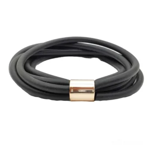 Multi-layer gothic rubber bangle top-down flat lay view with geometric black straps and metal clasp detail