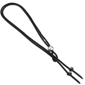 Adjustable black rubber rope necklace with silver pearl bead and metal fasteners, side flat lay perspective