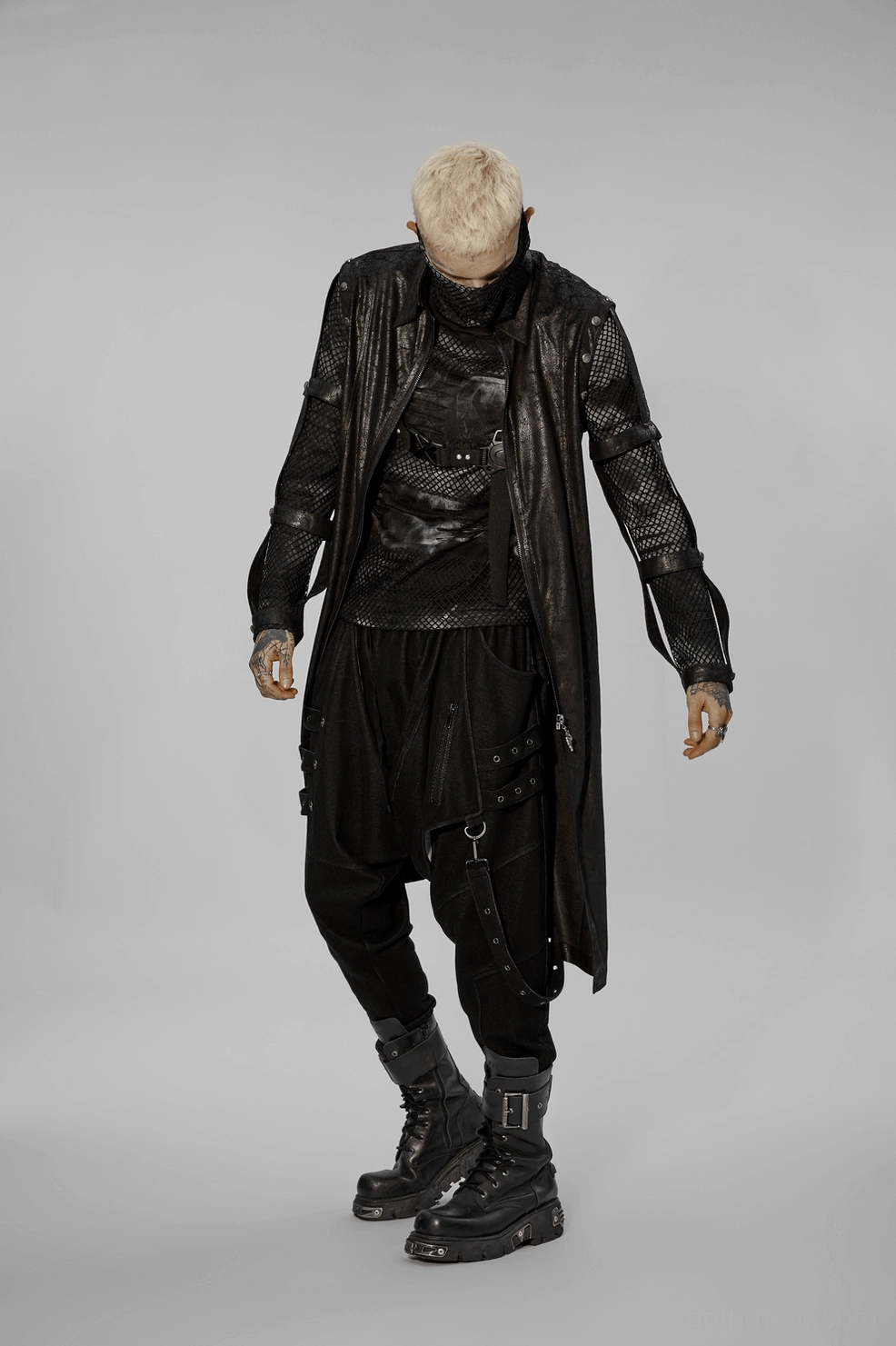 Full front view of gothic cracked rubber longline coat with detachable armor straps on model
