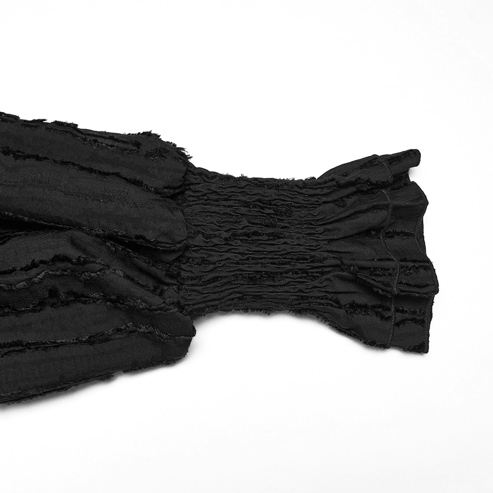 Close-up detail of gothic textured ruffle cuff with shirred detailing