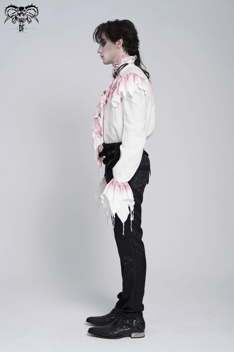 White gothic ruffle shirt with crimson frills worn by male model showing overall silhouette