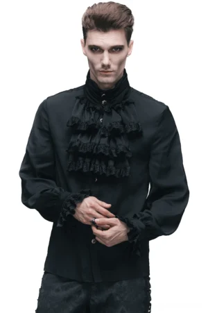 Front view of Victorian Gothic ruffled jabot tie shirt worn by male model, showcasing ornate ruffled collar and buttoned cuffs in black polyester