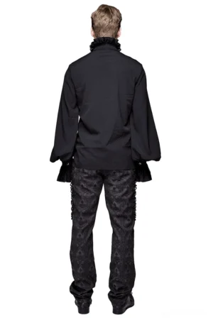 Black gothic long sleeve ruffled shirt back view on male model with patterned trousers