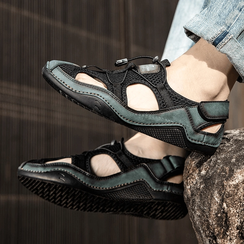 Men's gothic sandals detail shot of ankle-wrap straps and adjustable closure system mechanism