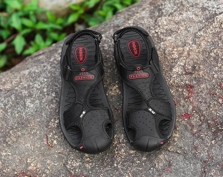 Alternative men's gothic sandals buckle closure and strap mechanism close-up