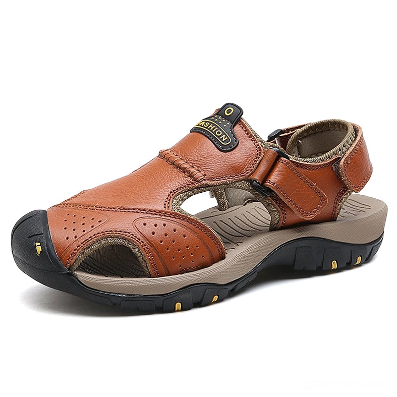 Caramel brown leather gothic sandals with stitched details and yellow outsole