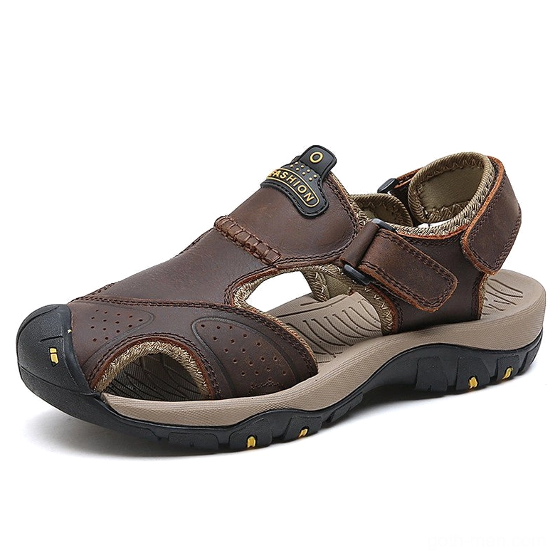 Dark brown leather gothic sandals with adjustable ankle strap and yellow outsole