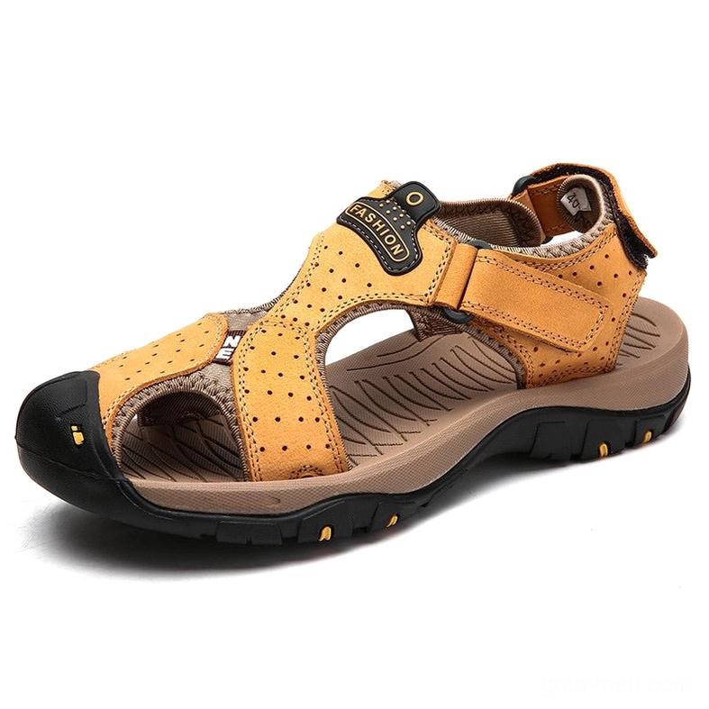 Mustard yellow perforated leather gothic sandals with hook-and-loop strap and contrasting yellow outsole