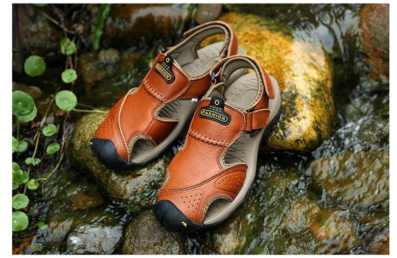 Close-up of mustard yellow gothic sandals highlighting perforated leather detailing