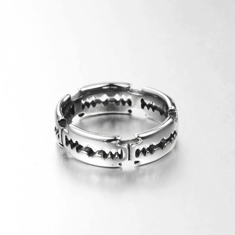 Industrial punk blade ring - top-down view with engraved sawtooth details on polished silver metal