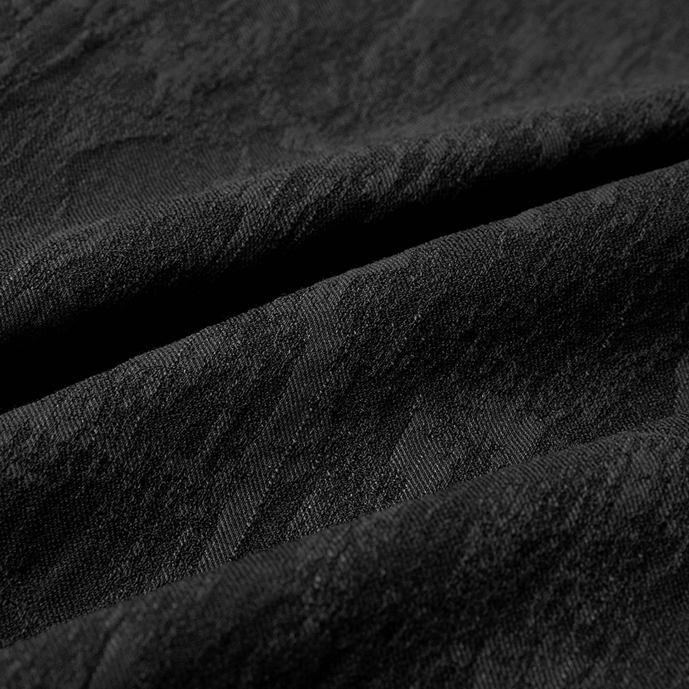 Black gothic jacquard shirt - detailed view of button construction and attachment to fabric