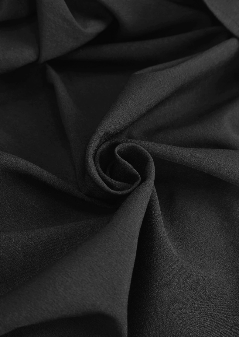 Gothic black shirt button and lace detail close-up on chest and collar area