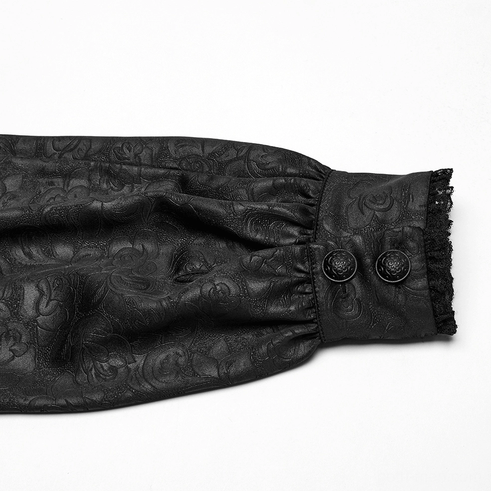 Close-up detail of buttoned cuff with lace trim and jacquard fabric weave on gothic shirt